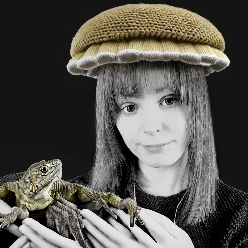 Vay holding a lizard.